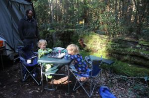 boys relax over a game of chess one morning at our campsite